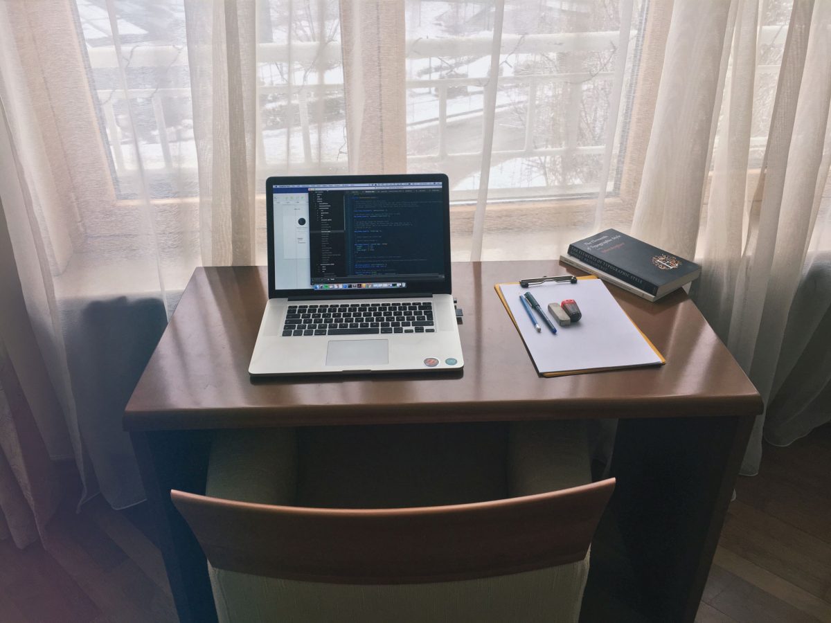 my writing desk with a view and a macbook